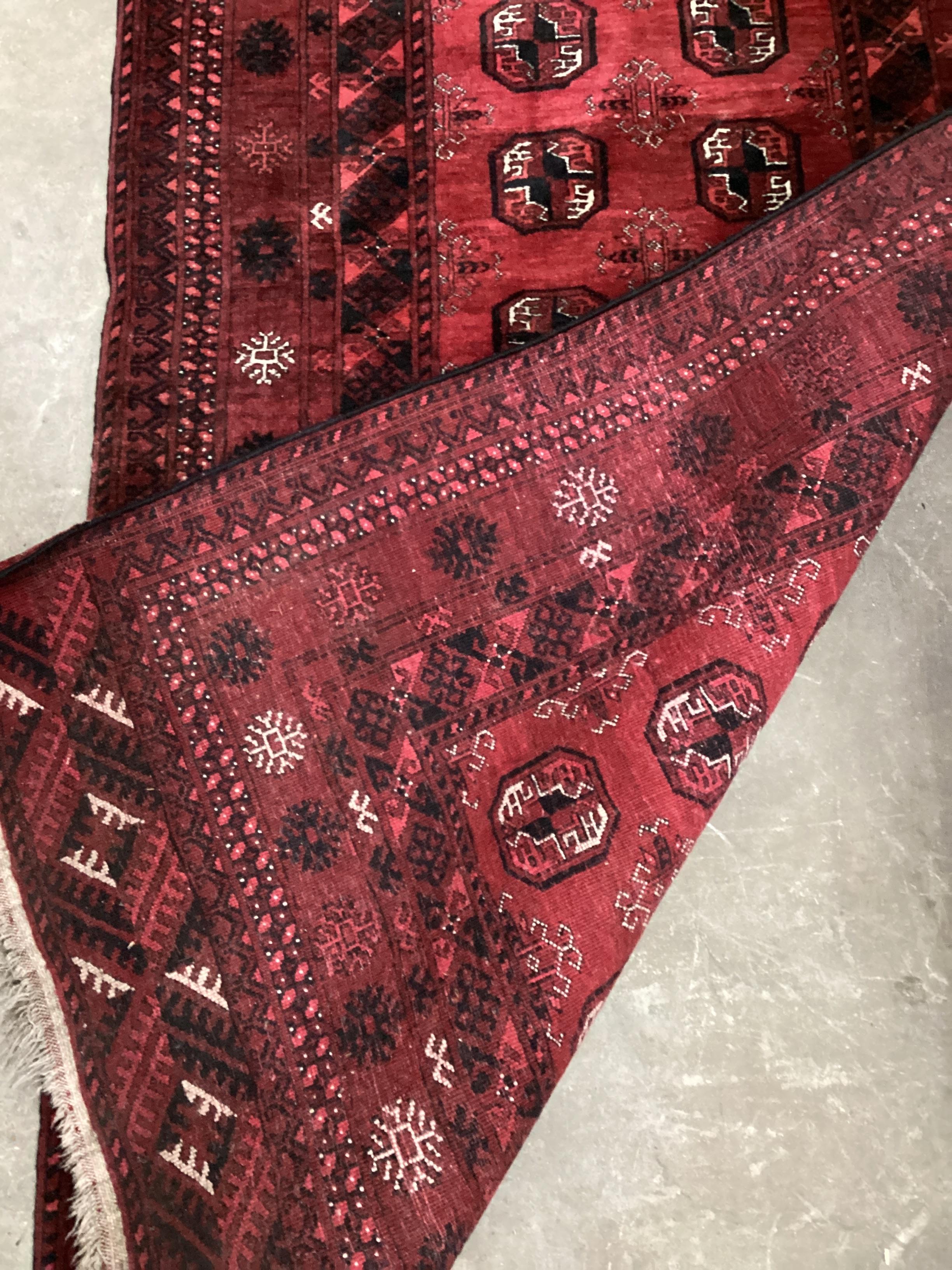 A Bokhara red ground runner, 266 x 100cm